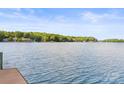 Expansive lake view from the property showcasing serene waters and tree-lined shores at 9289 Azalea Rd, Sherrills Ford, NC 28673