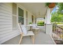 Charming front porch with seating area, ideal for relaxation and enjoying the outdoors at 1000 Oakshade Ave, Kannapolis, NC 28083