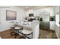Kitchen with granite counters, stainless steel appliances, breakfast bar, and hardwood floor at 118 Parker Claire Ln, Kings Mountain, NC 28086