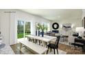 Open concept living and dining area with hardwood floors, white walls, and ample natural light at 118 Parker Claire Ln, Kings Mountain, NC 28086