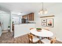 Cozy dining area featuring stylish light fixture and open layout to the kitchen, perfect for entertaining at 1215 Green Oaks Ln # H, Charlotte, NC 28205
