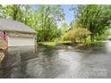 Spacious two-car garage with brick exterior and well-maintained landscaping at 1669 Mary Ellen Dr, Fort Mill, SC 29708