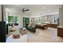 Open concept living room featuring kitchen, dining, and a sliding glass door to the outdoors at 1711 Summey Ave, Charlotte, NC 28205