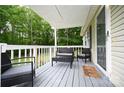 Relaxing covered front porch featuring outdoor furniture, perfect for enjoying the peaceful surroundings at 1821 Sherrer Rd, York, SC 29745