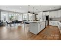 Spacious open kitchen with a center island, modern appliances, and hardwood flooring at 2062 Nellies Way, Fort Mill, SC 29715