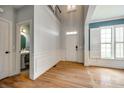 Bright foyer with hardwood floors, wainscoting and high ceilings leading into the house at 208 Mcduffie Ln, Fort Mill, SC 29715