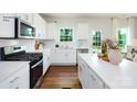 Bright kitchen featuring white cabinets, stainless steel appliances, and a view to the backyard at 227 Paige Rd, Kings Mountain, NC 28086