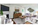 Cozy living room with a fireplace, comfortable seating, and large windows for natural light at 227 Paige Rd, Kings Mountain, NC 28086