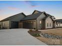 Attractive exterior with a three car garage, and concrete driveway at 2370 Bridgewater Rd, Rock Hill, SC 29730