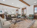 Spacious living room with wood beams, hardwood floors, and many windows at 2370 Bridgewater Rd, Rock Hill, SC 29730