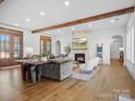 Open-concept living room featuring a stone fireplace and hardwood floors at 2370 Bridgewater Rd, Rock Hill, SC 29730