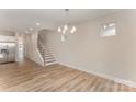 Bright living area with wood floors, stairway access and an eat-in kitchen at 2818 Old Steele Creek Rd, Charlotte, NC 28208