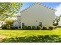 Spacious backyard featuring lush green grass and mature landscaping; perfect for outdoor enjoyment and relaxation at 3129 Summerfield Ridge Ln, Matthews, NC 28105