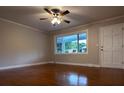 Bright living room featuring hardwood floors, a ceiling fan, and a large picture window at 404 Kings Dr # 7, Cherryville, NC 28021