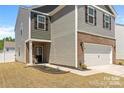 Two-story home with a two-car garage and lovely landscaping at 446 Misty Law Ln, Clover, SC 29710
