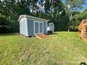 Two storage sheds in a spacious, grassy backyard at 517 Grassy Creek Run, Chester, SC 29706