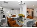 Open concept dining area with modern table, chairs, and view into kitchen and living room at 642 Brynwood Dr, Rock Hill, SC 29732