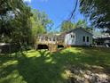Expansive backyard featuring a newly constructed wooden deck, perfect for outdoor entertaining at 66 Arlington Se Ave, Concord, NC 28025