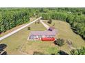 Spacious backyard view featuring large deck, fenced yard and exterior of home at 725 Hunters Ridge Rd, Taylorsville, NC 28681