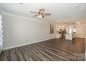 Spacious living room with hardwood floors and modern ceiling fan at 110 Synandra Dr # B, Mooresville, NC 28117