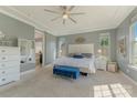 Spacious bedroom with tray ceiling, plush carpet, and ample natural light at 11333 Preservation Ln, Charlotte, NC 28278