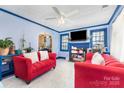 The bright living room features fresh paint, tile flooring, and large windows at 1308 Edgewood Rd, Charlotte, NC 28208
