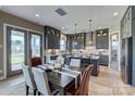 Bright kitchen and dining area features stainless steel appliances and ample storage at 18125 Sulton Terrace Dr, Huntersville, NC 28078