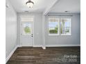 Bright entryway with wood floors, a storm door, and natural light, providing a welcoming first impression at 1957 Tablerock Dr # 59, York, SC 29745