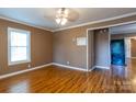 Inviting living room with laminate flooring, natural light, and paneled walls at 205 Stowe Acres Rd, Kings Mountain, NC 28086