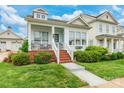 Inviting two-story home with a porch, brick steps and an easy to maintain landscaped yard at 23128 Goose Down Ln, Lancaster, SC 29720