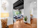 Inviting entryway seamlessly connects to the open living space with exposed ceilings and modern decor at 2338 Yadkin Ave # D302, Charlotte, NC 28205