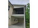 Exterior view of a covered back patio with ceiling and brick accents at 2442 Falcon Ln, Statesville, NC 28625