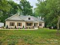 Charming brick home with well-manicured lawn and lush landscaping at 2442 Falcon Ln, Statesville, NC 28625