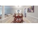 Elegant dining room showcasing modern lighting, hardwood floors, and stylish furniture at 2715 Selwyn Ave # 36, Charlotte, NC 28209