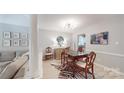 Elegant dining room featuring modern lighting, hardwood floors, and views of the living area at 2715 Selwyn Ave # 36, Charlotte, NC 28209