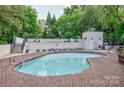 Inviting outdoor pool area with lounge chairs and well-maintained surroundings, perfect for relaxation and recreation at 2715 Selwyn Ave # 36, Charlotte, NC 28209