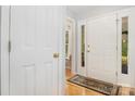 Inviting foyer featuring a bright, white front door and hardwood floors at 2906 Chapman Cir, Rock Hill, SC 29732
