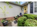 Inviting front entrance with a yellow door, lovely potted plants, and decorative wreath at 2906 Chapman Cir, Rock Hill, SC 29732