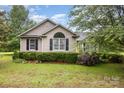Charming single story home with lush landscaping and inviting curb appeal in a quiet neighborhood at 2906 Chapman Cir, Rock Hill, SC 29732