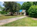 A single Gathering home with a long driveway nestled among mature trees at 3316 Fairhaven Rd, Rock Hill, SC 29732