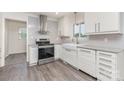 Bright kitchen features shaker cabinets, stainless steel appliances, and gray countertops at 3555 Tree Line Dr, Rock Hill, SC 29732