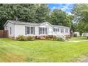 Attractive single-story home featuring a well-manicured lawn and charming front entrance with stairs at 403 Carpenter Parker Ln, Rock Hill, SC 29730