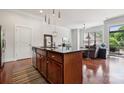 Lovely kitchen with stainless appliances, granite counters and an island with seating at 411 Steel Gardens Blvd, Charlotte, NC 28205