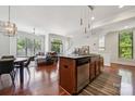 Open layout with stainless appliances, granite counters, an island and great light at 411 Steel Gardens Blvd, Charlotte, NC 28205