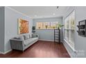 Cozy living room with a comfortable gray couch and ample natural light at 4531 Dalbeth St, Charlotte, NC 28213