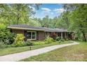 Beautiful brick home with mature landscaping and a winding walkway at 507 Richards Dr, Shelby, NC 28150