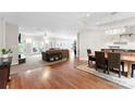 Open-concept living room with hardwood floors, neutral walls, and plenty of natural light at 5418 Commodore Pl, Clover, SC 29710