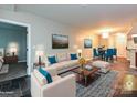 Comfortable living room with neutral colors, cozy seating, and artwork, creating a serene atmosphere at 718 W Trade St, Charlotte, NC 28202