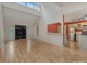 Open-concept living area with hardwood floors, high ceilings and modern lighting at 7312 Barcliff Dr, Charlotte, NC 28212
