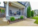 Inviting front porch with rocking chairs and stylish landscaping at 8024 Eagle St, Mount Pleasant, NC 28124